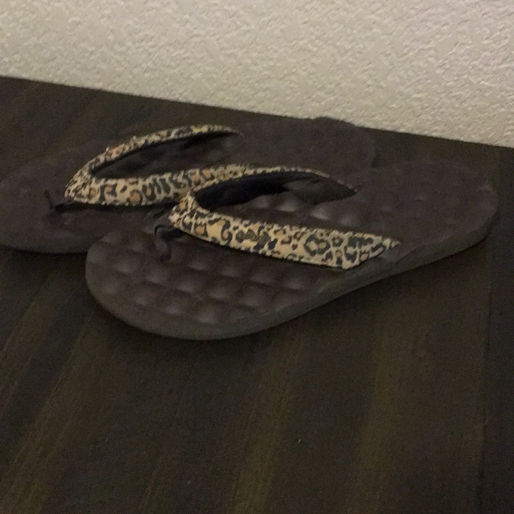 Reef leopard flip flops